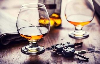Alcohol on a table with car keys Alcohol on a table with car keys